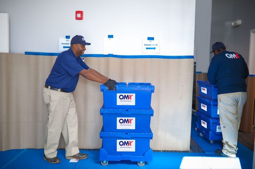 OMX movers pushing crates